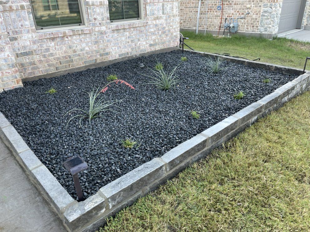 After: chop-stone border with Tejas gravel and grasses
