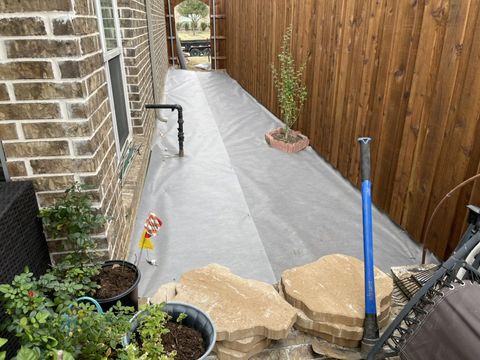 Weed barrier laid before the rock