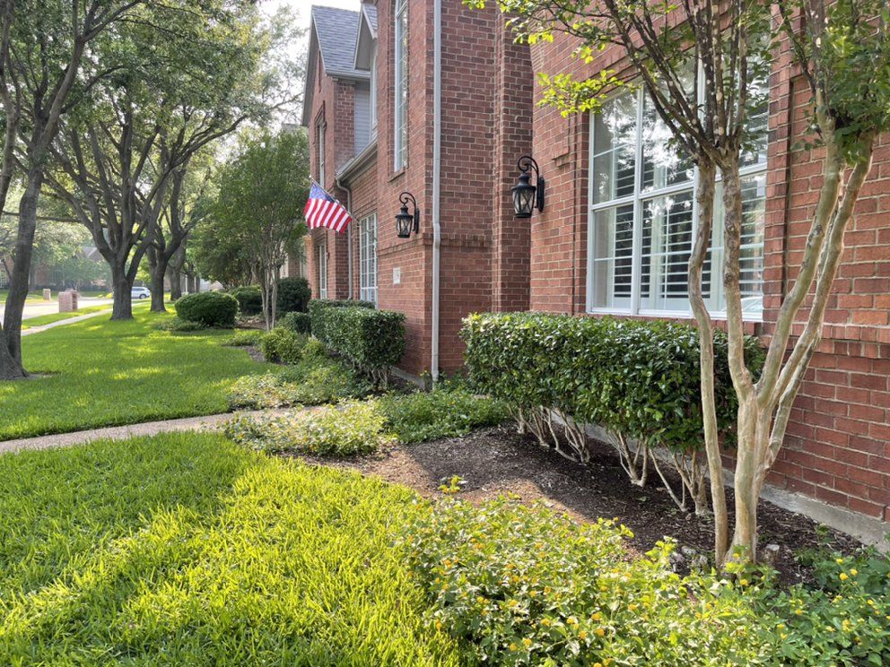 Shrub enhancements at a brick home
