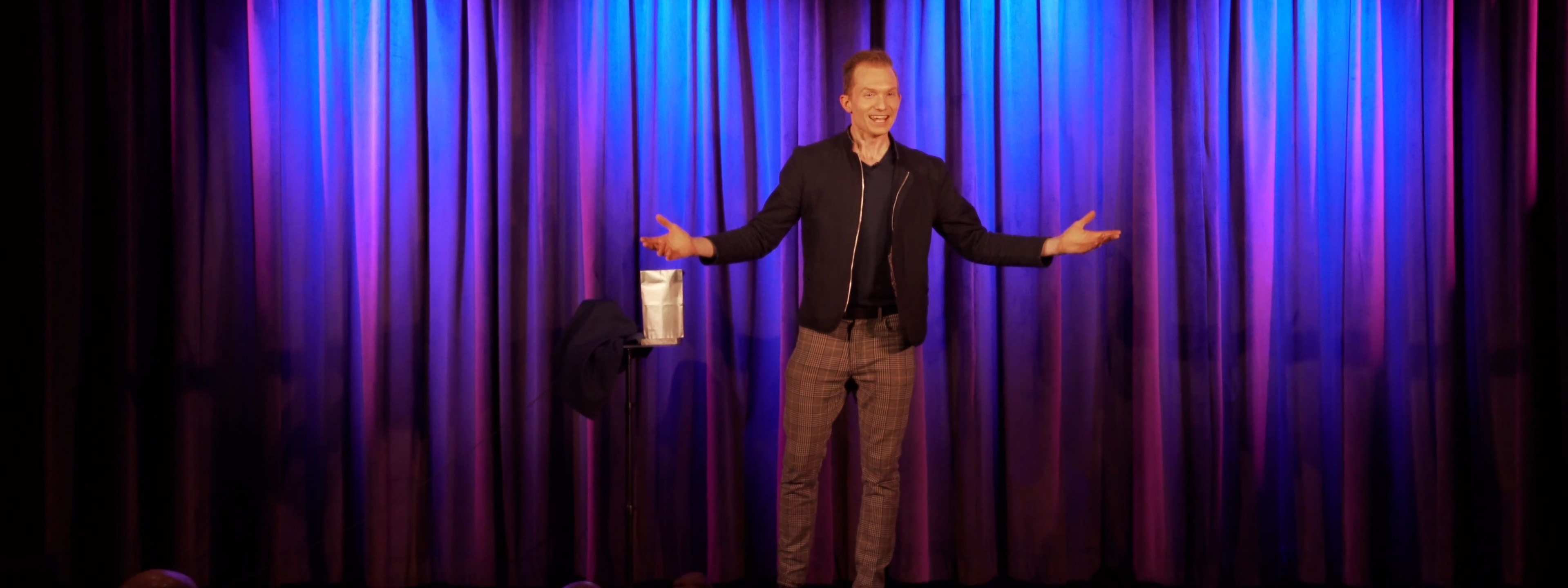 Amazed audience reacting during a live magic show at The Magic Studio Orlando