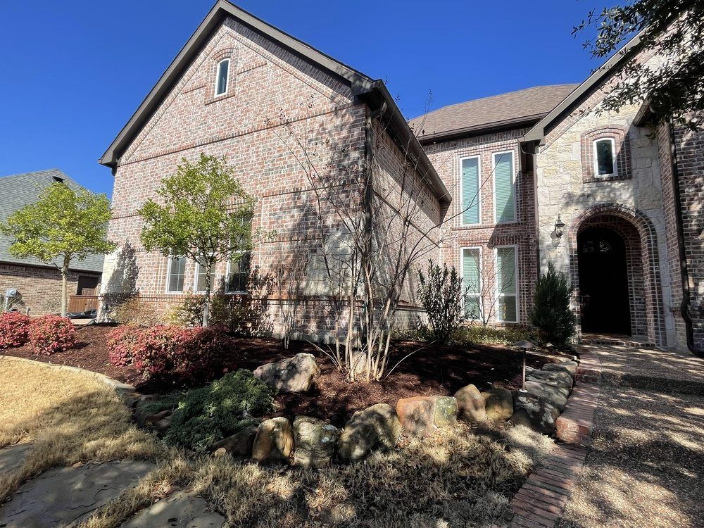 McKinney front yard after tree shaping and bed refresh