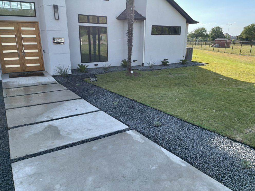 Front-yard design and install with agave, sago and yucca in Tejas gravel