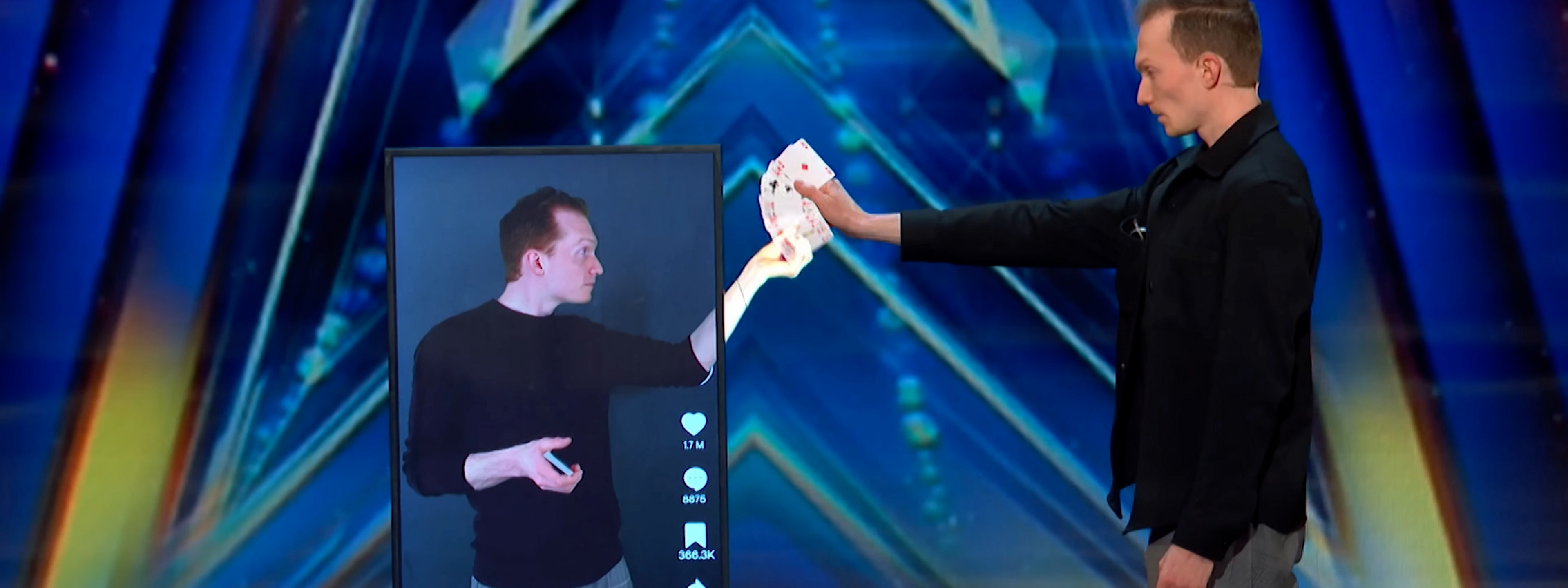 Trigg Watson on stage with high-tech magic effects