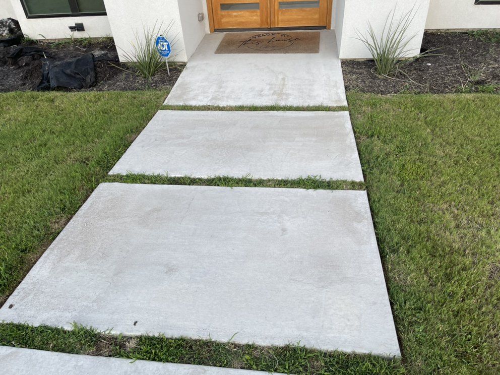 Before: builder-grade front yard with bare beds