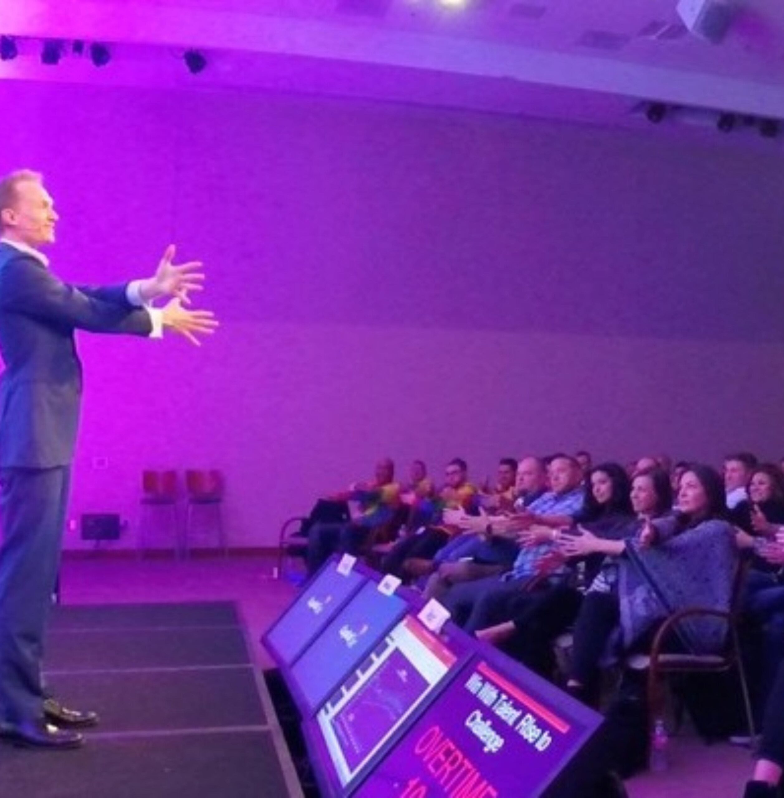 Trigg commands the stage at a live event.